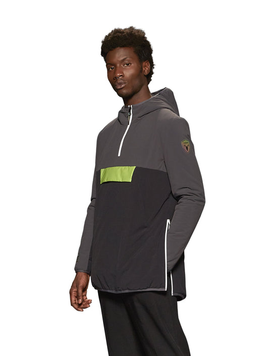 Unisex thigh length hooded anorak with vertical zipper along collar, side zippers along torso, and centre zipper pouch with a reflective flap, in Steel Grey/Black + Steel Grey/Black