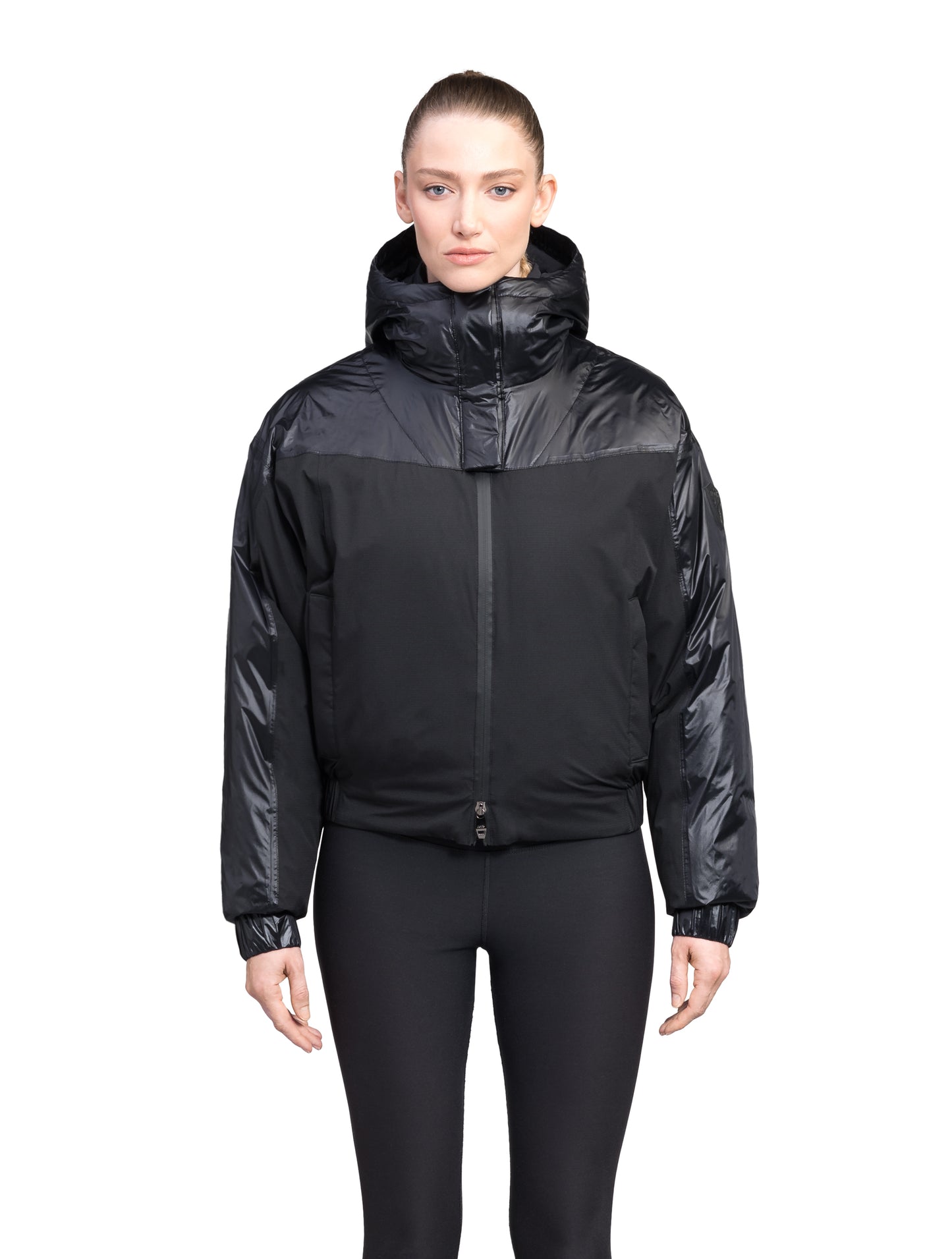 Aspen Women's Batwing Jacket in hip length, premium stretch ripstop and cire technical nylon taffeta fabrication, Premium Canadian White Duck Down insulation, non-removable down-filled hood, centre front two-way zipper, winged arm detailing, in Black