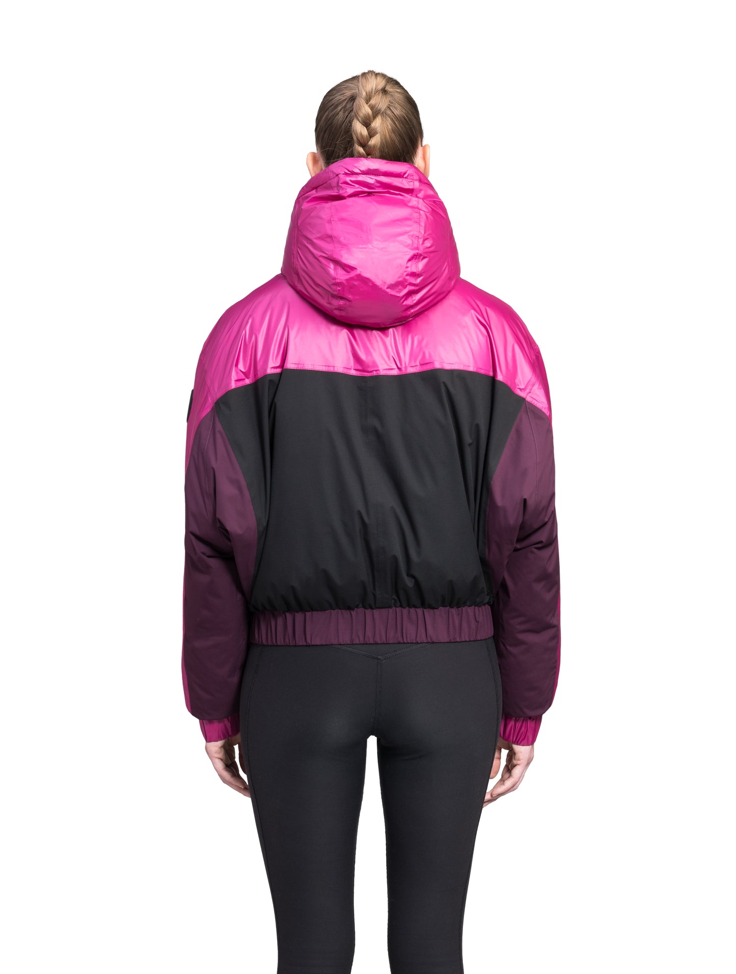 Aspen Women's Batwing Jacket in hip length, premium stretch ripstop and cire technical nylon taffeta fabrication, Premium Canadian White Duck Down insulation, non-removable down-filled hood, centre front two-way zipper, winged arm detailing, in Festival Fushia/Potent Purple