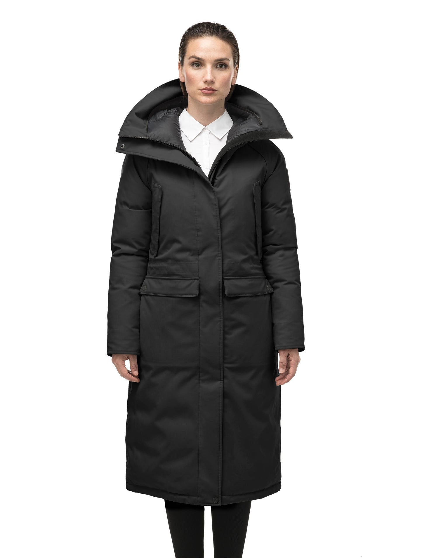 Ladies knee length down-filled parka with four exterior pockets, and a non-removable hood with detachable fur trim in Black