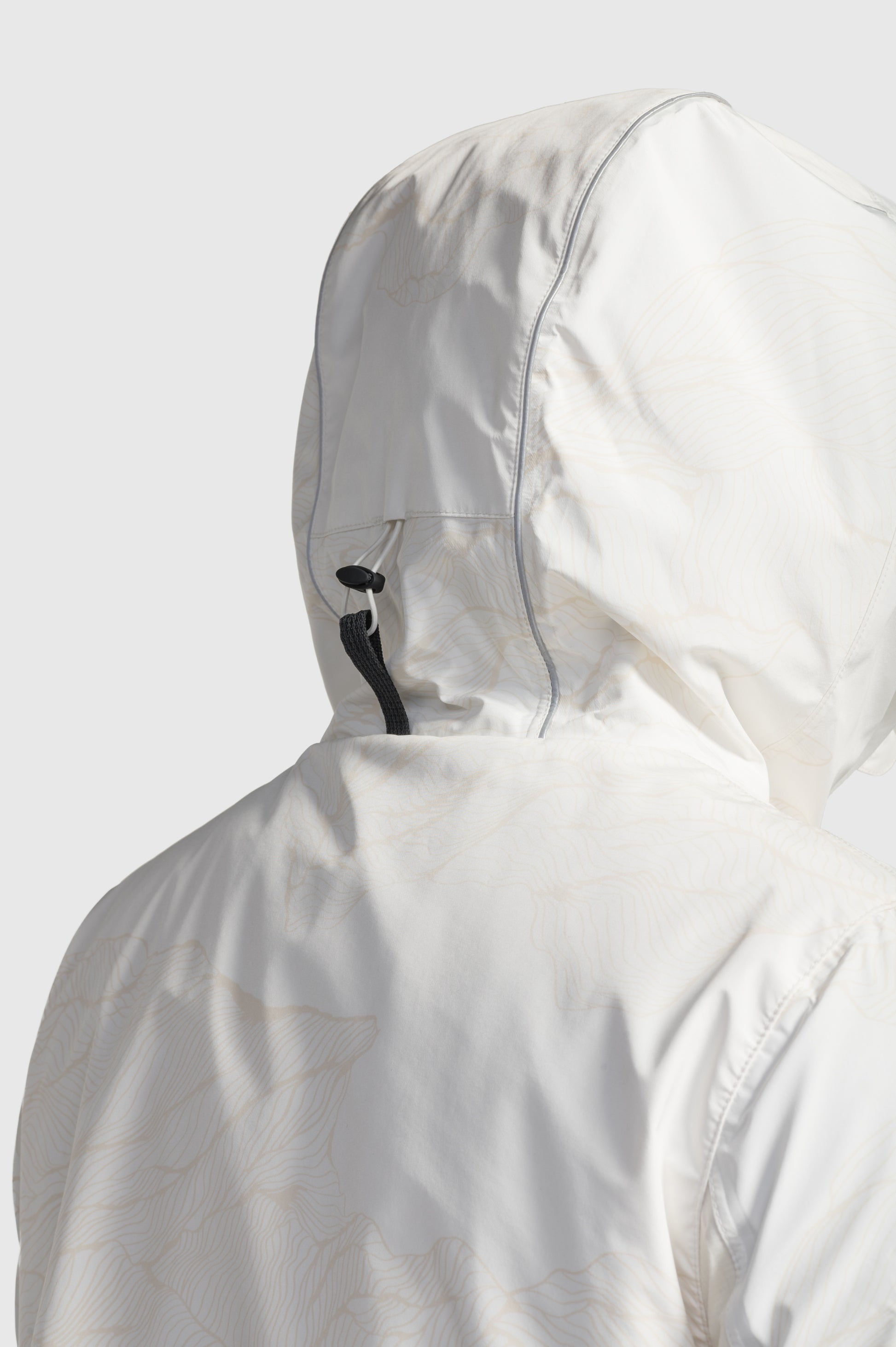 Alta Men's Performance Shell Jacket in hip length, Primaloft Gold Insulation Active+, chest and waist pockets, ventilation under arms, reflective detailing on hood and back, two-way front zipper, and non-removable hood with adjustable drawstrings, in Wheat Desert