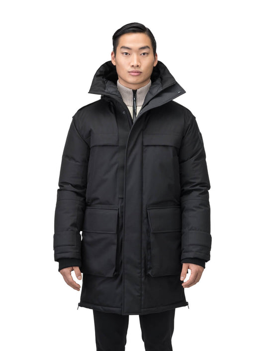 Alum Men's Long Parka in thigh length, Premium Canadian White Duck Down insulation, non-removable hood with removable coyote fur trim, two-way centre front zipper with magnetic closure wind flap, four exterior patch pockets at front, in Black + Black / XS
