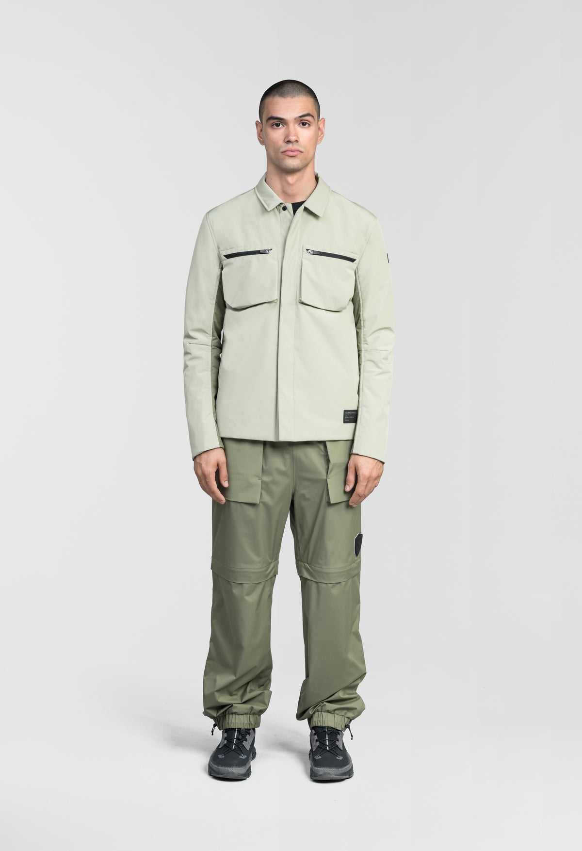 Ander Men's Mid Layer Shirt in hip length, PrimaLoft Gold Insulation Active+, 3-Ply Micro Denier front and 4-Way Durable Stretch Weave back, zipper chest pockets, snap button wind flap, and snap button cuffs, in Tea/Clover