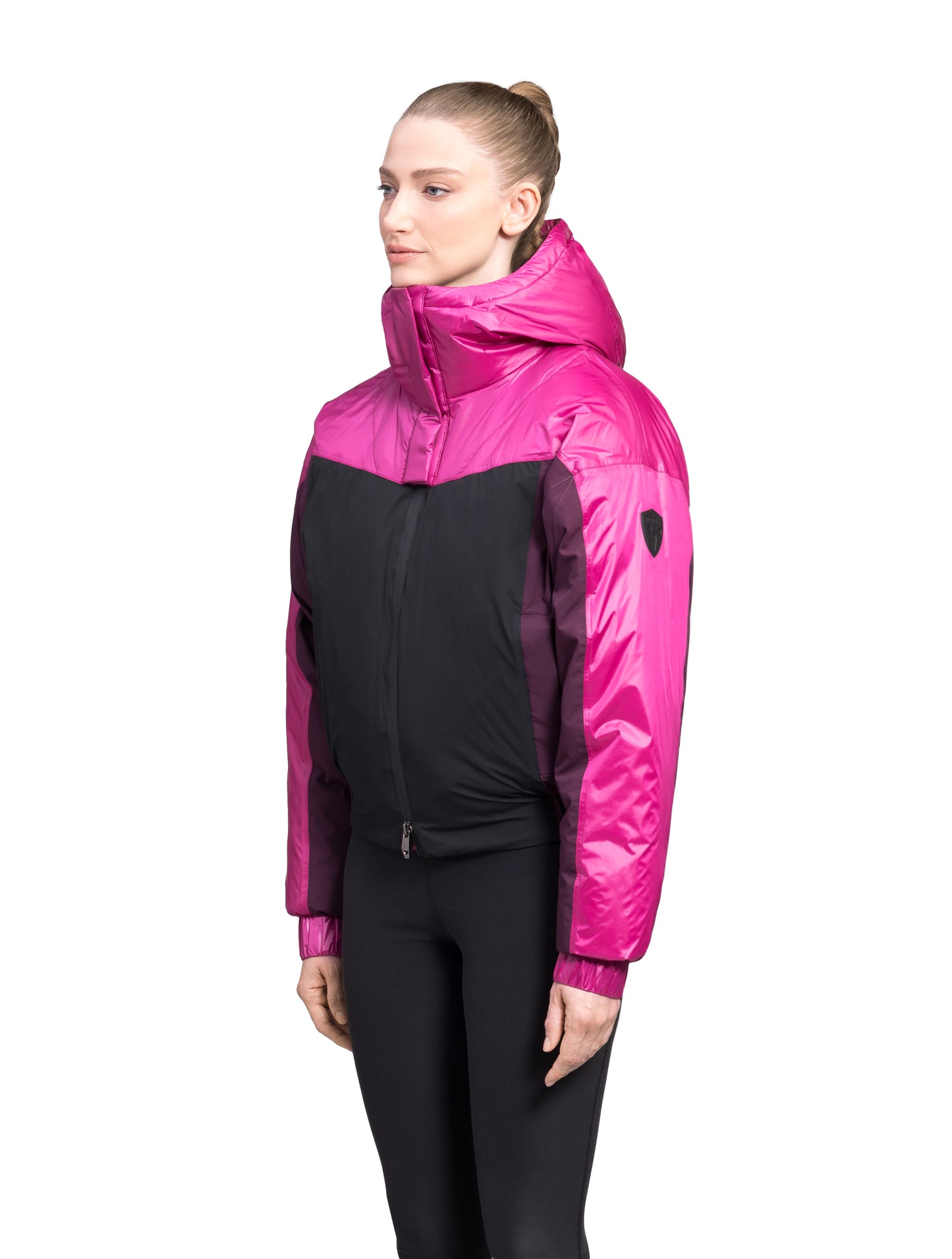 Aspen Women's Batwing Jacket in hip length, premium stretch ripstop and cire technical nylon taffeta fabrication, Premium Canadian White Duck Down insulation, non-removable down-filled hood, centre front two-way zipper, winged arm detailing, in Festival Fushia/Potent Purple