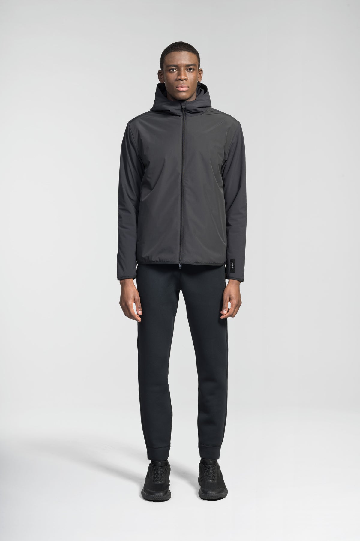 Men's hip length mid layer jacket with non-removable hood and two-way zipper in Black