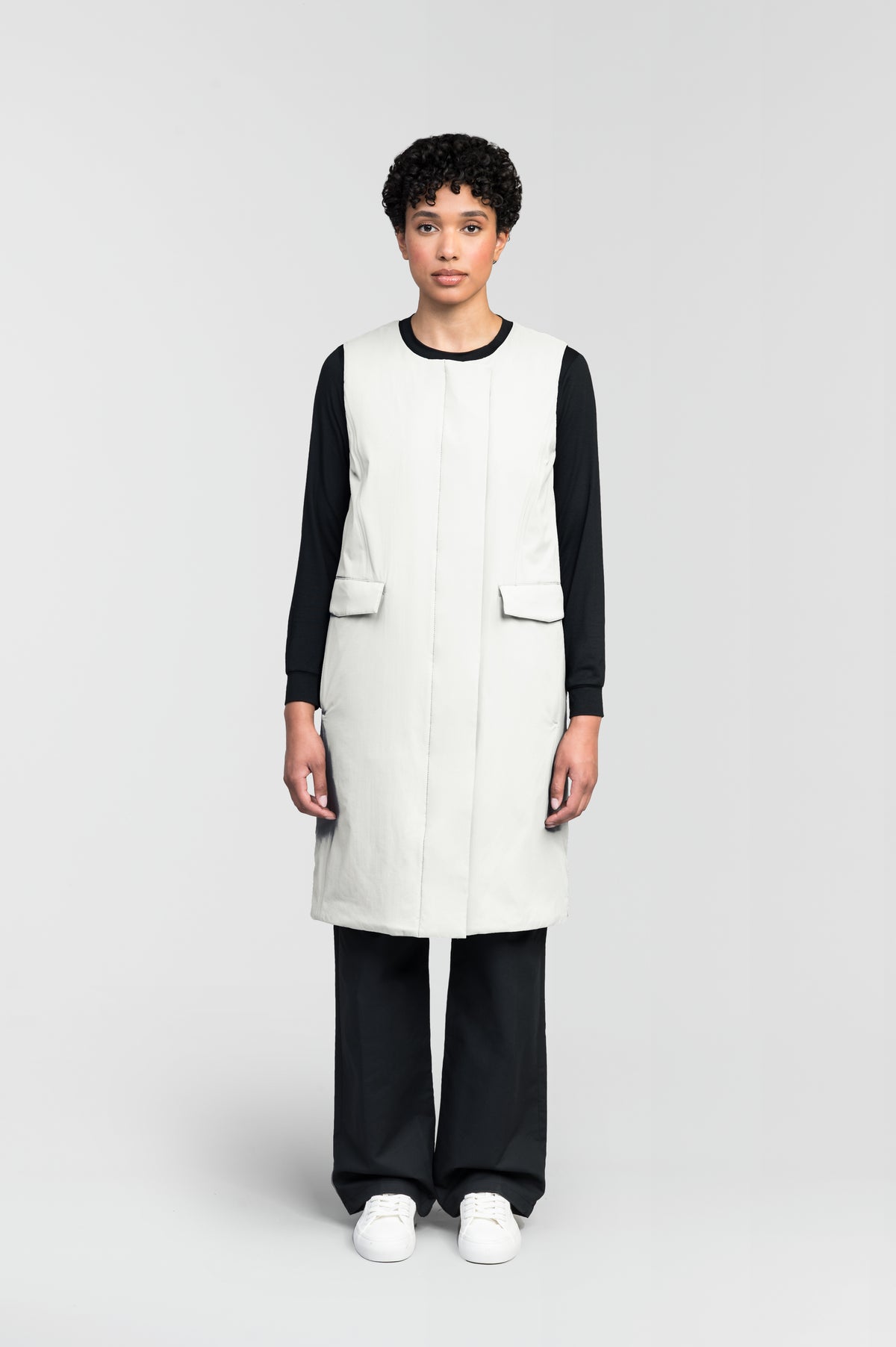 Brexton Women's Tailored Long Mid Layer Vest in knee length, centre front wind flap, flap closure waist pocket with additional side entry storage, single vent on back bottom hem, in Chalk