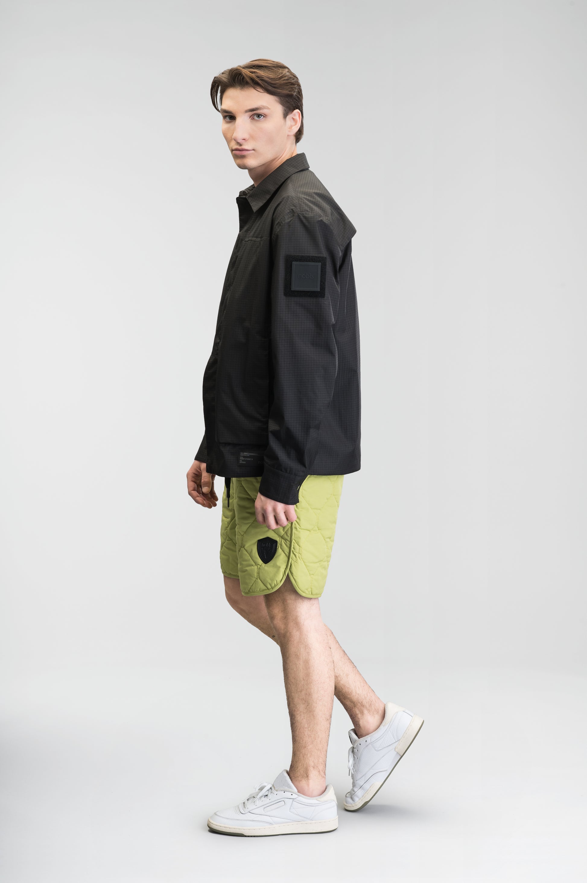 Curt Men's Performance Quilted Shorts at knee length, premium stretch nylon and stretch ripstop fabricaiton, premium 4-way stretch, water resistant Primaloft Gold Insulation Active+, side seam pockets, exteriror back pocket, elasticized waist with drawcords, and notch detailing at side seams, in Dark Citron