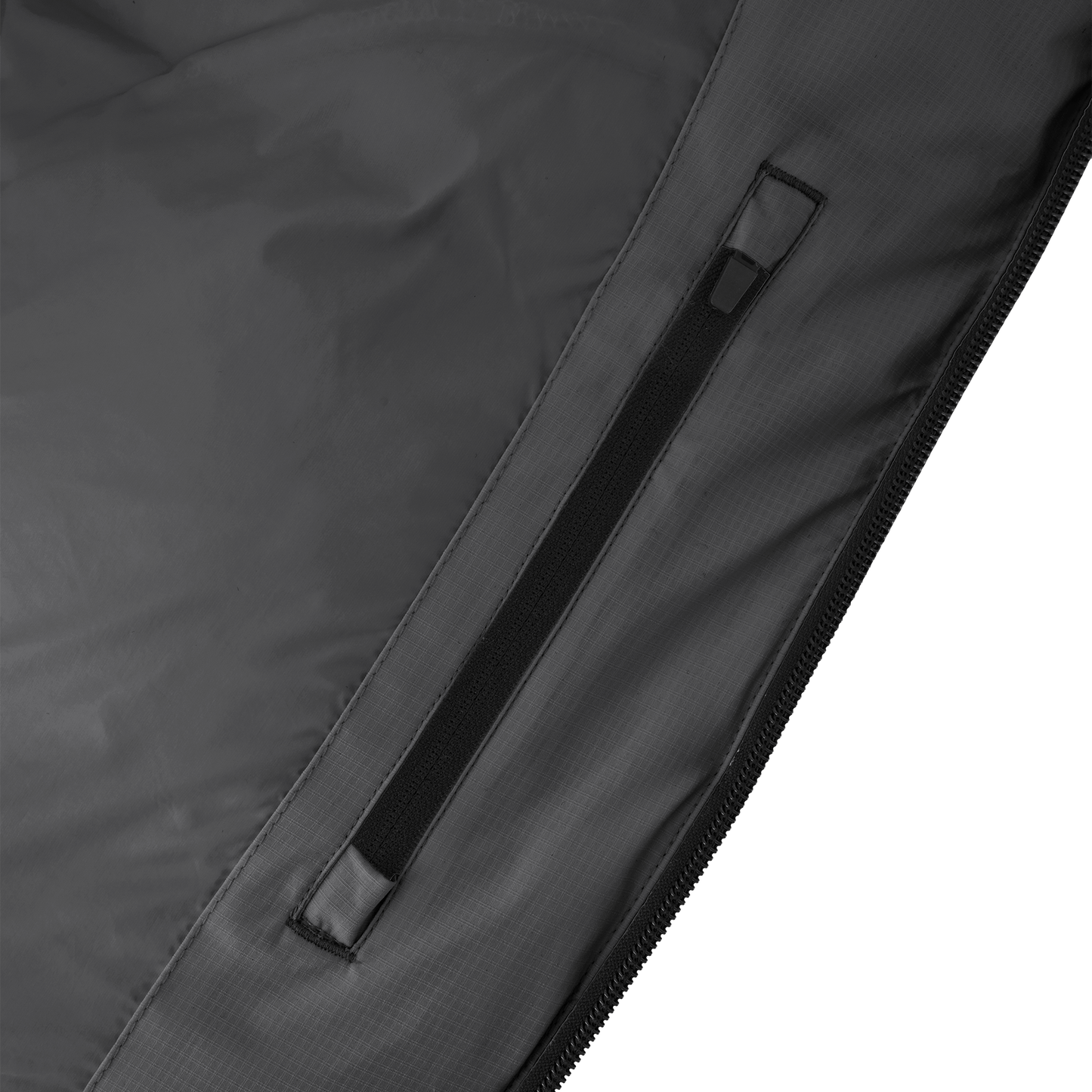 Dixon jacket in Black stretch ripstop fabric with DWR coating, large bellow pockets with magnetic flaps, hidden side-entry zipper pockets, and adjustable cuffs and hem for a tailored fit. Durable, weather-resistant, and versatile.