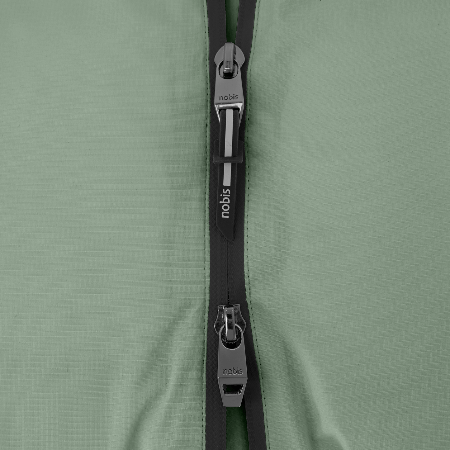 Dixon jacket in Duck Green stretch ripstop fabric with DWR coating, large bellow pockets with magnetic flaps, hidden side-entry zipper pockets, and adjustable cuffs and hem for a tailored fit. Durable, weather-resistant, and versatile.