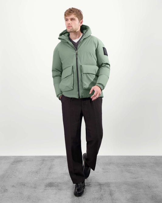 Dixon jacket in Duck Green stretch ripstop fabric with DWR coating, large bellow pockets with magnetic flaps, hidden side-entry zipper pockets, and adjustable cuffs and hem for a tailored fit. Durable, weather-resistant, and versatile. + Duck Green / XXS