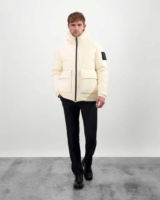 Dixon jacket in Wheat stretch ripstop fabric with DWR coating, large bellow pockets with magnetic flaps, hidden side-entry zipper pockets, and adjustable cuffs and hem for a tailored fit. Durable, weather-resistant, and versatile. + Wheat / XXS