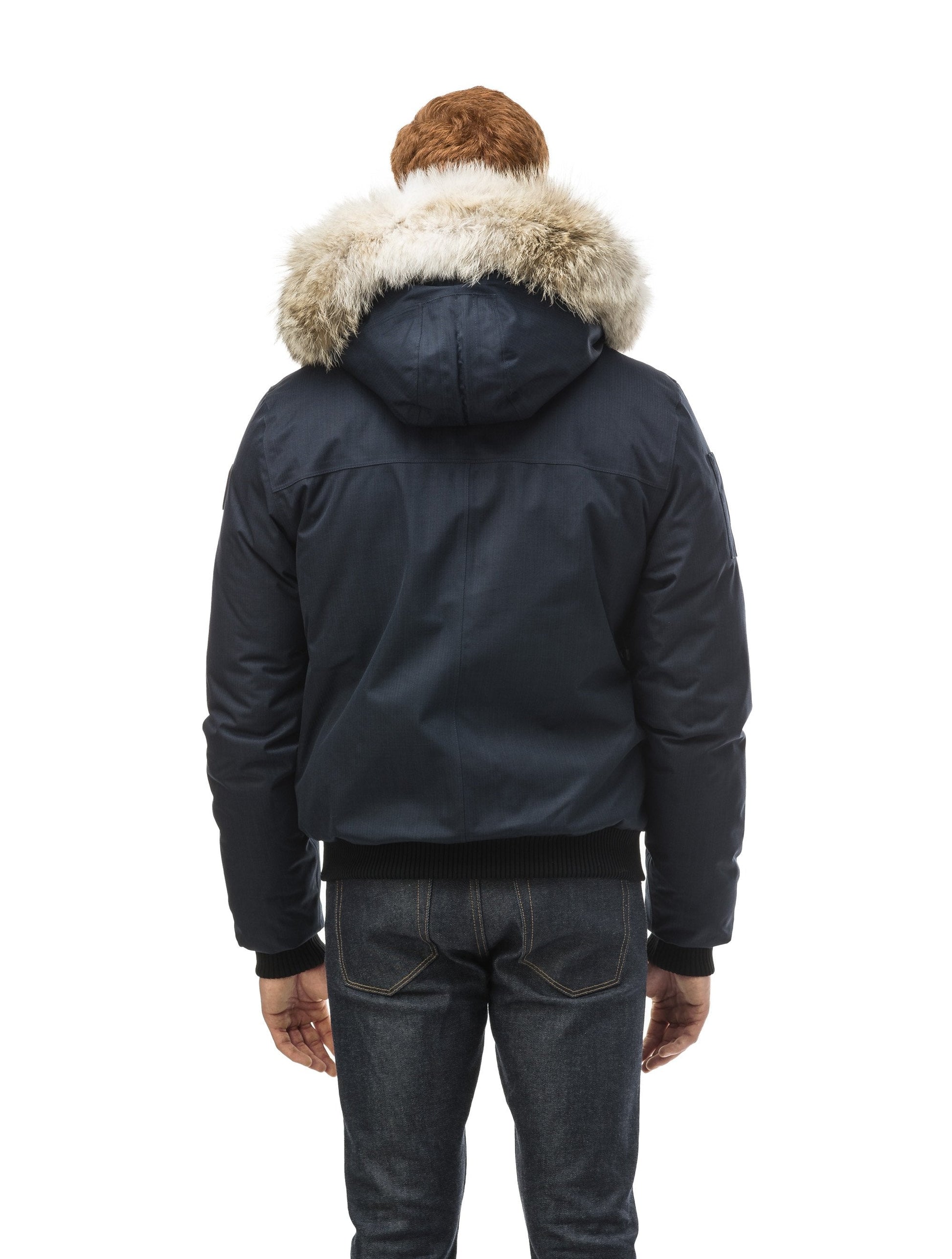 Men's classic down filled bomber jacket with a down filledÃƒÆ’Ã†â€™Ãƒâ€ Ã¢â‚¬â„¢ÃƒÆ’Ã‚Â¢ÃƒÂ¢Ã¢â‚¬Å¡Ã‚Â¬Ãƒâ€¦Ã‚Â¡ÃƒÆ’Ã†â€™ÃƒÂ¢Ã¢â€šÂ¬Ã…Â¡ÃƒÆ’Ã¢â‚¬Å¡Ãƒâ€šÃ‚Â hood that features a removable coyote fur trim and concealed moldable framing wire in Navy