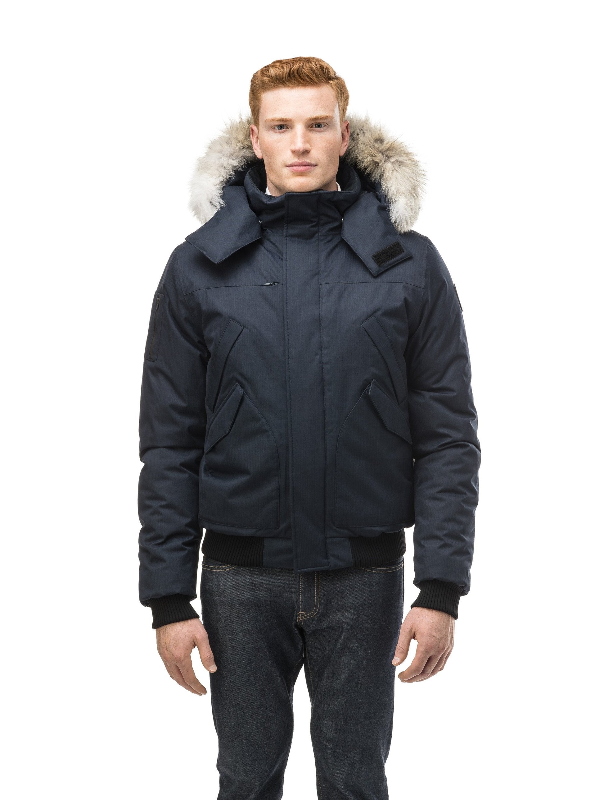 Men's classic down filled bomber jacket with a down filledÃƒÆ’Ã†â€™Ãƒâ€ Ã¢â‚¬â„¢ÃƒÆ’Ã‚Â¢ÃƒÂ¢Ã¢â‚¬Å¡Ã‚Â¬Ãƒâ€¦Ã‚Â¡ÃƒÆ’Ã†â€™ÃƒÂ¢Ã¢â€šÂ¬Ã…Â¡ÃƒÆ’Ã¢â‚¬Å¡Ãƒâ€šÃ‚Â hood that features a removable coyote fur trim and concealed moldable framing wire in Navy