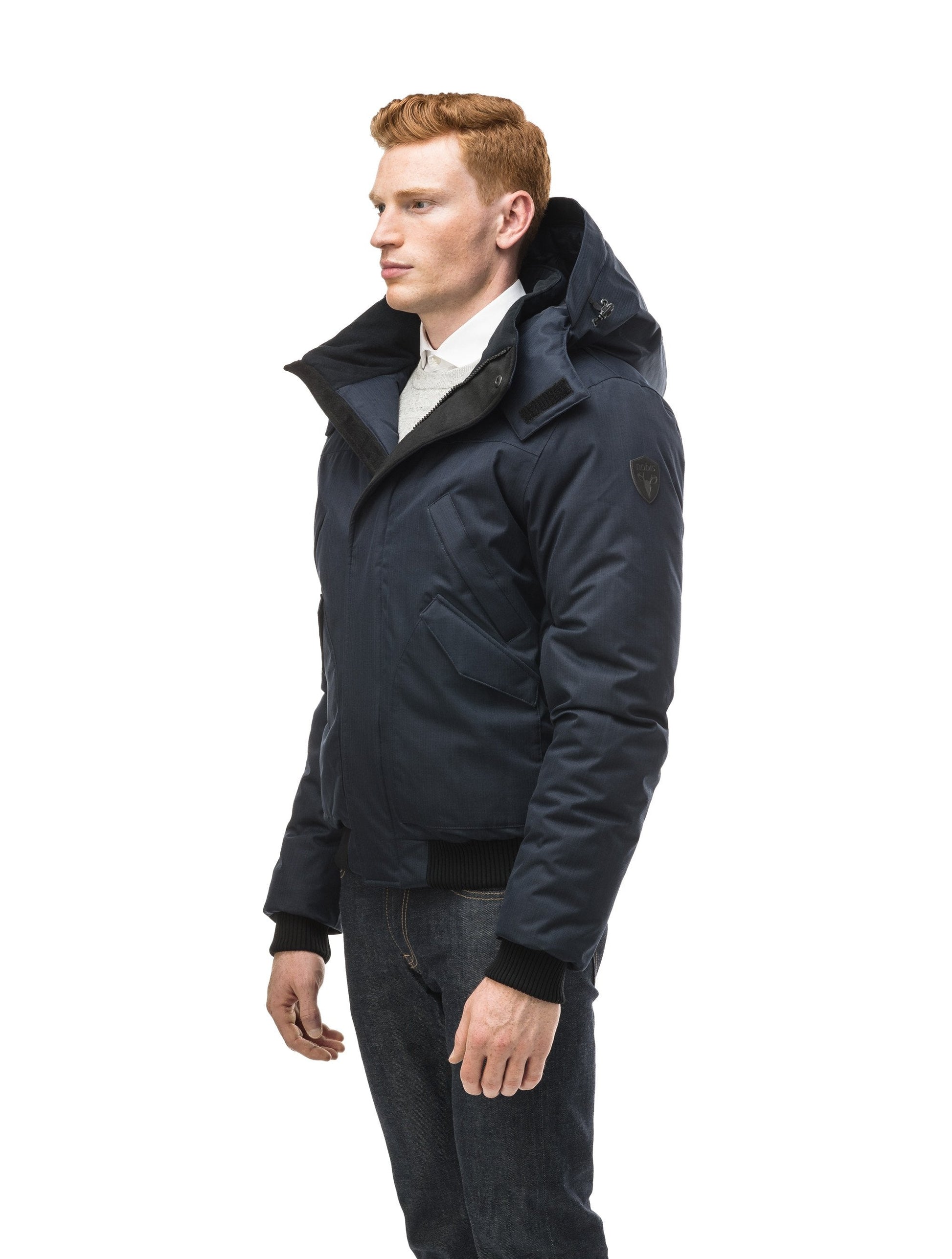 Men's classic down filled bomber jacket with a down filledÃƒÆ’Ã†â€™Ãƒâ€ Ã¢â‚¬â„¢ÃƒÆ’Ã‚Â¢ÃƒÂ¢Ã¢â‚¬Å¡Ã‚Â¬Ãƒâ€¦Ã‚Â¡ÃƒÆ’Ã†â€™ÃƒÂ¢Ã¢â€šÂ¬Ã…Â¡ÃƒÆ’Ã¢â‚¬Å¡Ãƒâ€šÃ‚Â hood that features a removable coyote fur trim and concealed moldable framing wire in Navy