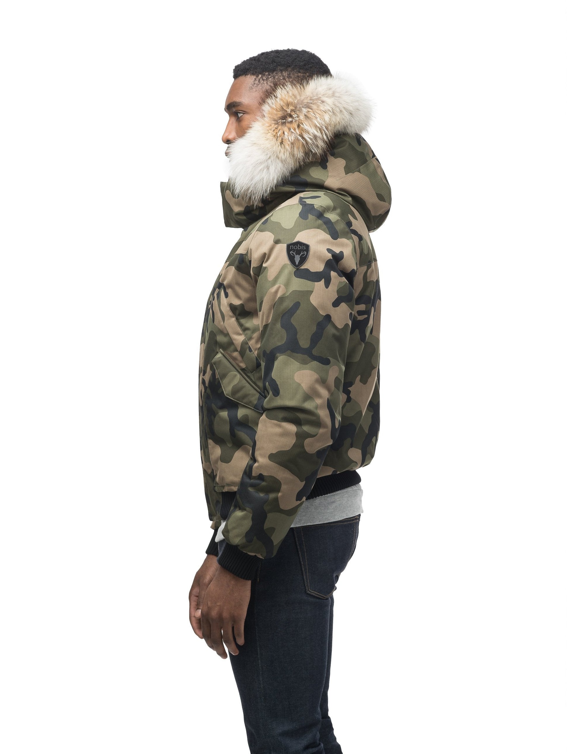 Men's classic down filled bomber jacket with a down filledÃƒÆ’Ã†â€™Ãƒâ€ Ã¢â‚¬â„¢ÃƒÆ’Ã‚Â¢ÃƒÂ¢Ã¢â‚¬Å¡Ã‚Â¬Ãƒâ€¦Ã‚Â¡ÃƒÆ’Ã†â€™ÃƒÂ¢Ã¢â€šÂ¬Ã…Â¡ÃƒÆ’Ã¢â‚¬Å¡Ãƒâ€šÃ‚Â hood that features a removable coyote fur trim and concealed moldable framing wire in Camo