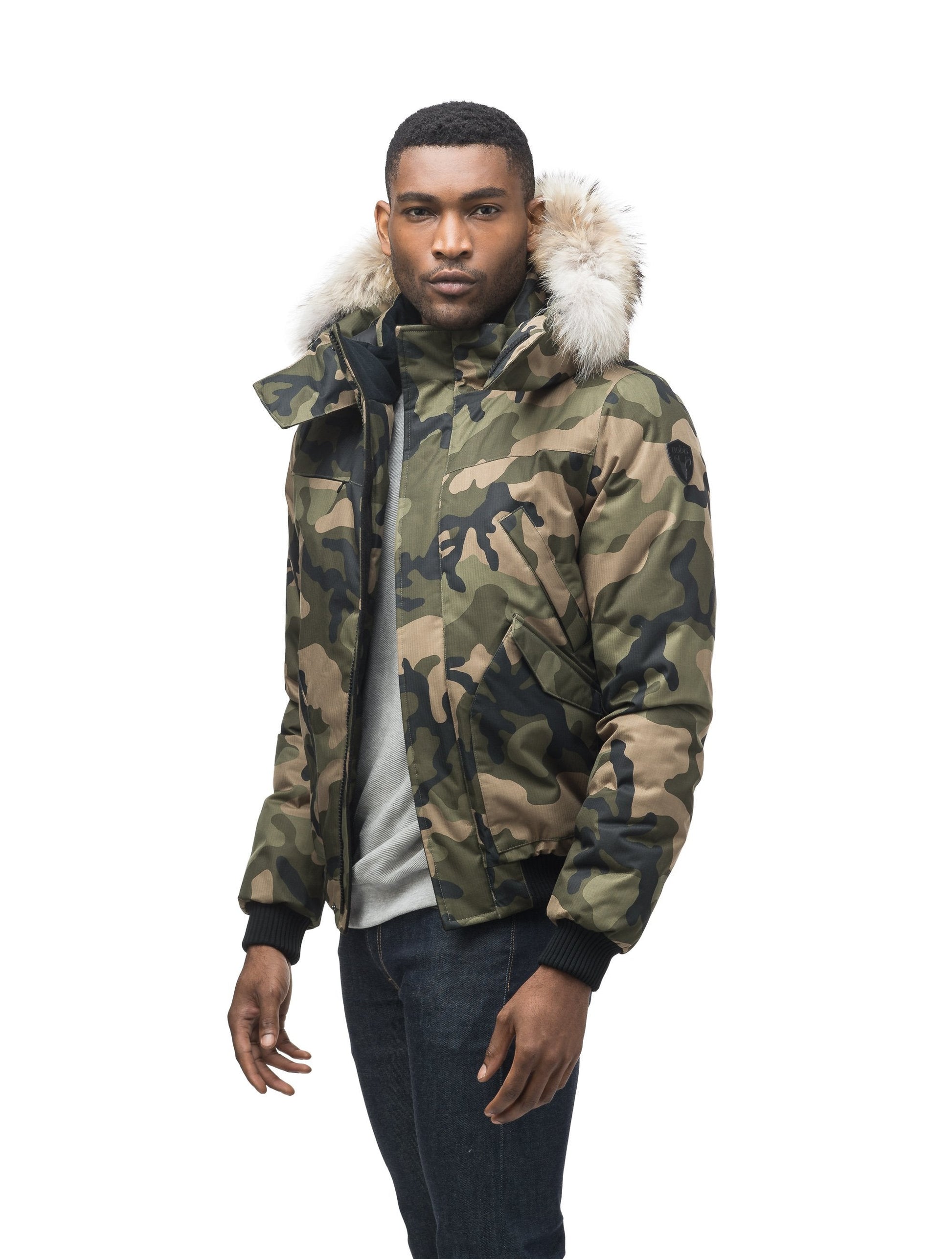 Men's classic down filled bomber jacket with a down filledÃƒÆ’Ã†â€™Ãƒâ€ Ã¢â‚¬â„¢ÃƒÆ’Ã‚Â¢ÃƒÂ¢Ã¢â‚¬Å¡Ã‚Â¬Ãƒâ€¦Ã‚Â¡ÃƒÆ’Ã†â€™ÃƒÂ¢Ã¢â€šÂ¬Ã…Â¡ÃƒÆ’Ã¢â‚¬Å¡Ãƒâ€šÃ‚Â hood that features a removable coyote fur trim and concealed moldable framing wire in Camo