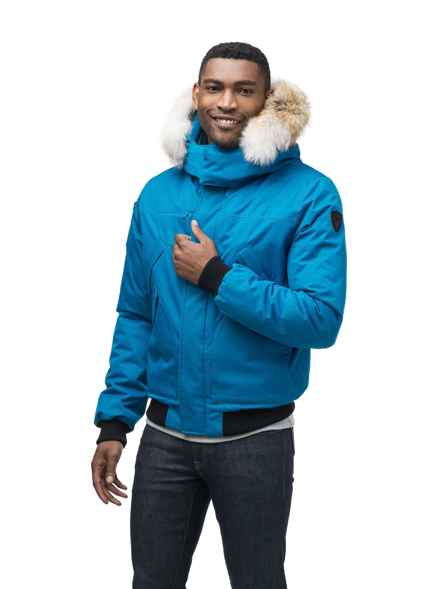 Men's classic down filled bomber jacket with a down filledÃƒÆ’Ã†â€™Ãƒâ€ Ã¢â‚¬â„¢ÃƒÆ’Ã‚Â¢ÃƒÂ¢Ã¢â‚¬Å¡Ã‚Â¬Ãƒâ€¦Ã‚Â¡ÃƒÆ’Ã†â€™ÃƒÂ¢Ã¢â€šÂ¬Ã…Â¡ÃƒÆ’Ã¢â‚¬Å¡Ãƒâ€šÃ‚Â hood that features a removable coyote fur trim and concealed moldable framing wire in Sea Blue