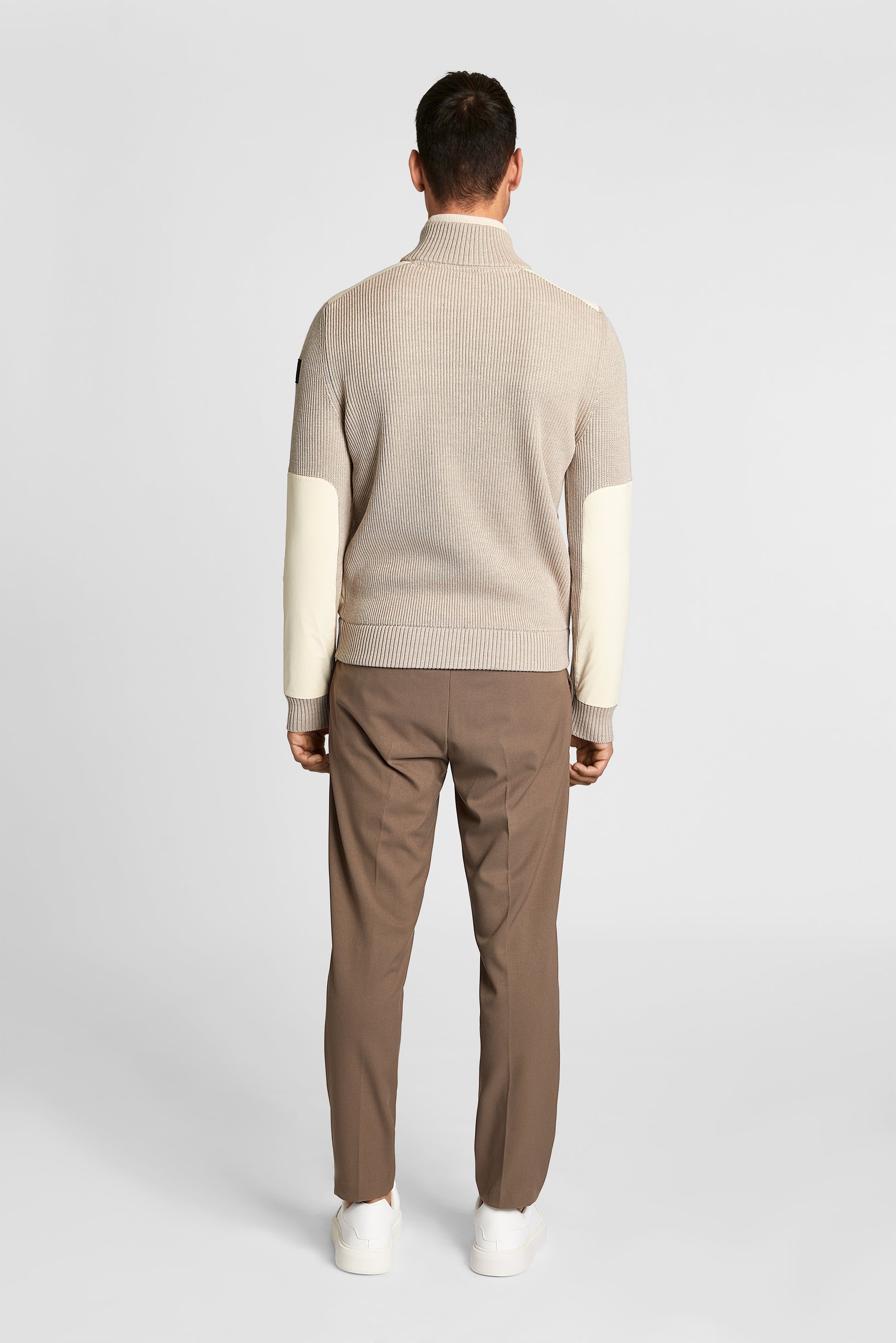 Ero Men's Tailored Hybrid Sweater in hip length, PrimaLoft Gold Insulation Active+, Durable 4-Way Stretch Weave quilted torso, Merino wool knit collar, sleeves, back, and cuffs, two-way front zipper, and hidden waist pockets, in Wheat