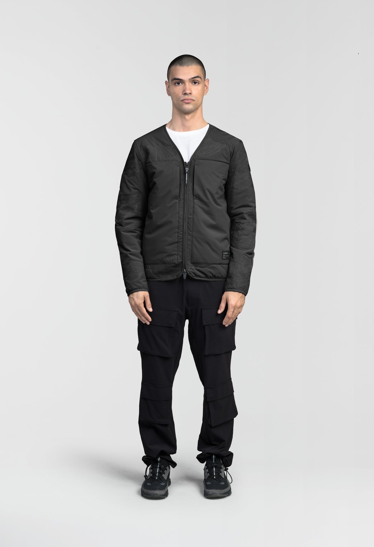 Gates Men's Performance Quilted V-Neck Jacket in hip length, centre front two-way zipper, hidden zipper chest pockets, side entry waist pockets, in Black