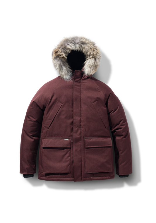 Men's waist length down filled jacket with two front pockets with magnetic closure and a removable fur trim on the hood in Merlot + Merlot