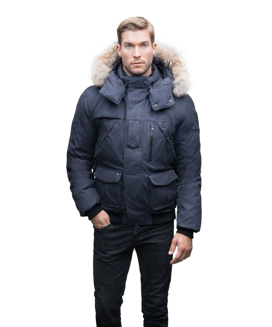 Men's classic down bomber with two patch pockets and a right shoulder storm flap in H. Navy + H. Navy