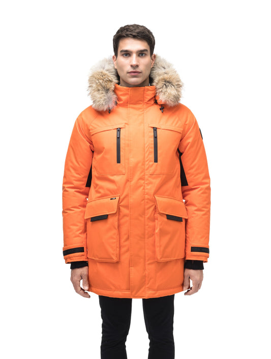 Men's thigh length down-filled parka with removable hood and removable coyote fur trim in Atomic + Atomic
