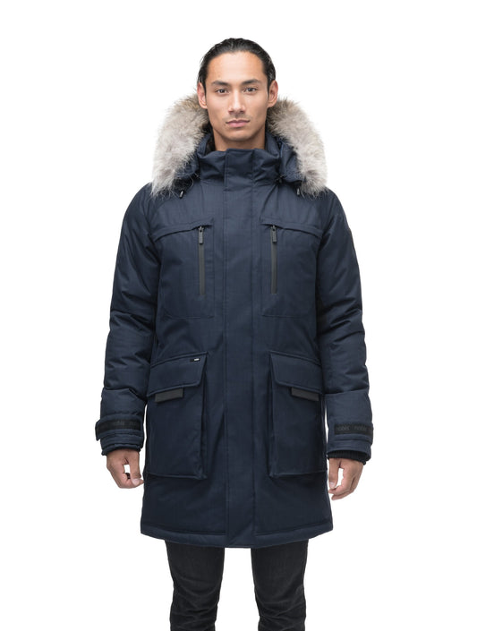 Men's thigh length down-filled parka with removable hood and removable coyote fur trim in Navy + Navy