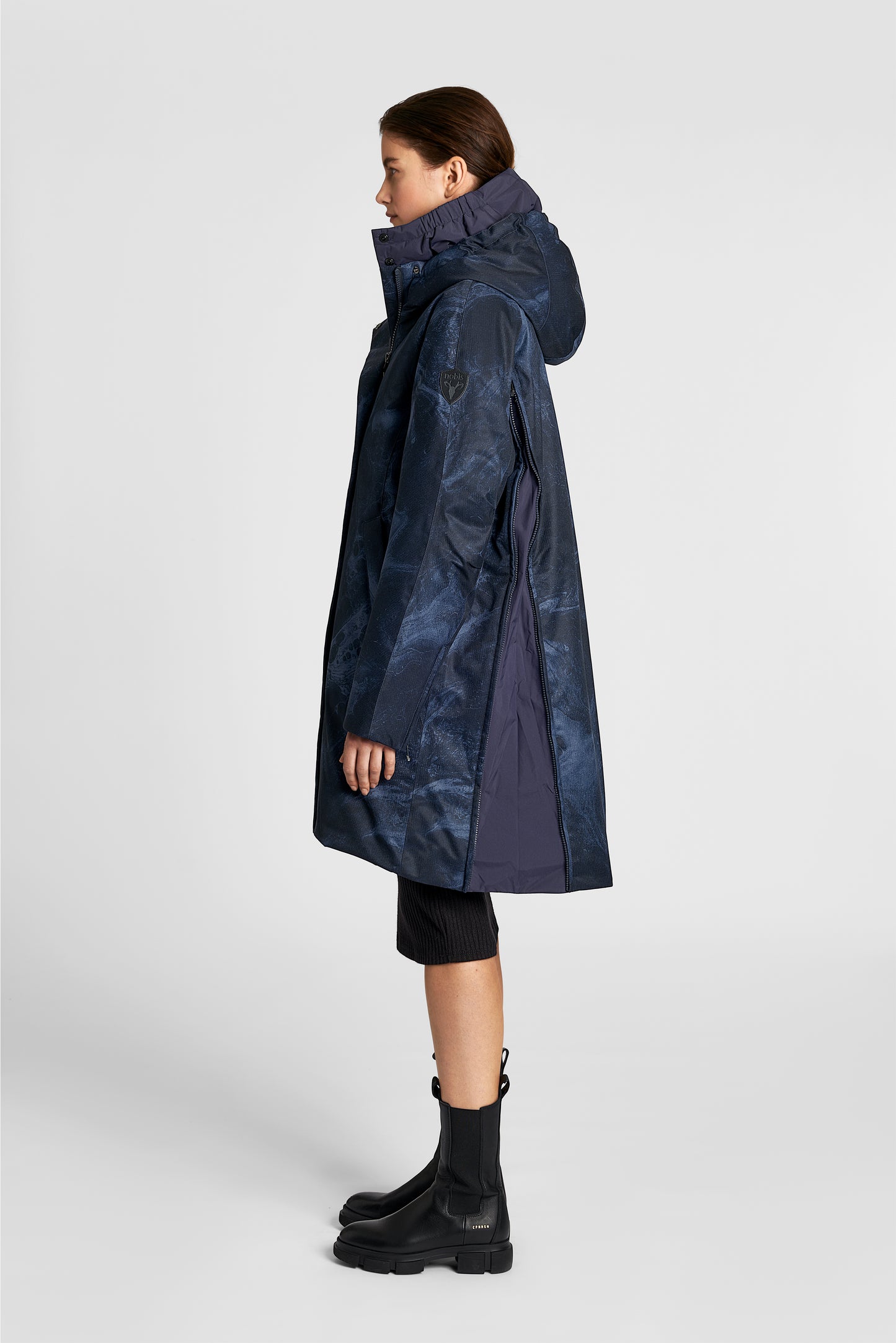Dory Women's Tailored Back Zip Parka in knee length, premium Crosshatch fabrication, Premium Canadian White Duck Down insulation, non-removable down-filled hood, removable interior hood, centre front two-way zipper with wind flap, vertical zipper detailing along back, in Navy