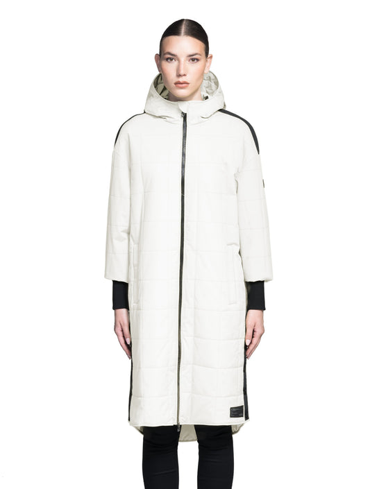 Radar Women's Performance Long Midlayer Jacket in long length, premium stretch ripstop and stretch Toray nylon fabrication, premium 4-way stretch, water resistant Primaloft Gold Insulation Active+, non-removable hood with adjustable draw cord, 2-way branded zipper at centre front, single welt pockets with magnetic closure at hips, elongated ribbed cuffs, grosgrain ribbon detail at shoulder and side seams, and snap closure side seam vent, in Chalk + Chalk