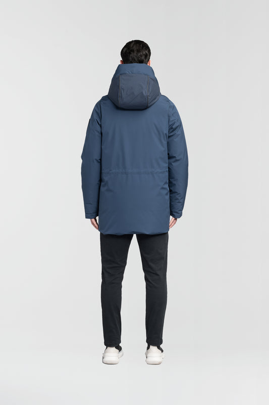 Ronin Men's Performance Utility Jacket in thigh length, premium 3-ply micro denier and stretch ripstop fabrication, Premium Canadian origin White Duck Down insulation, non-removable down-filled hood, bellow chest pockets, magnetic closure waist flap pockets, two-way centre-front zipper, pit zipper vents, hidden adjustable waist drawcord, in Marine + Marine