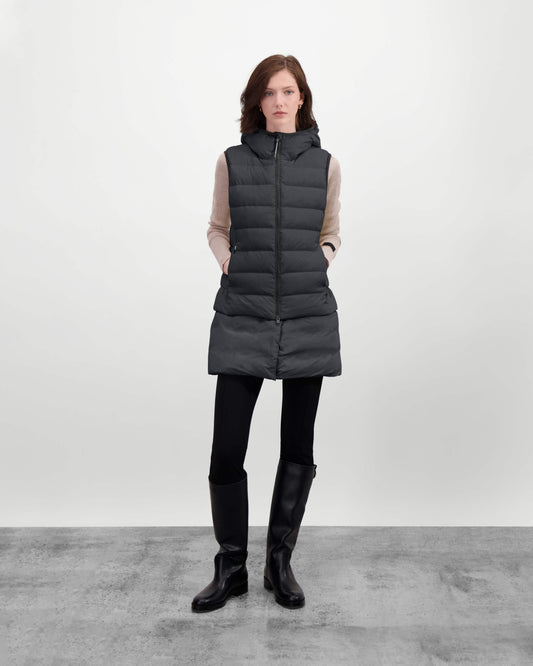 Saratoga puffer vest in Black insulated with Canadian white duck down, featuring stretch nylon ribbing for mobility, hidden waist drawcord, and a tailored fit for warmth and style. Lightweight and ideal for layering. + Black / XXS