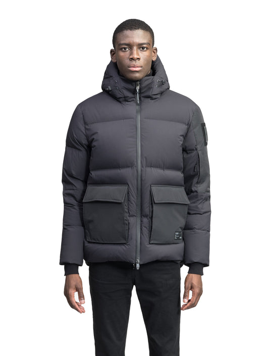 Supra Men's Performance Puffer in hip length, Technical Taffeta and 3-Ply Micro Denier fabrication, Premium Canadian White Duck Down insulation, non-removable down filled hood, centre front two-way zipper, flap pockets at waist, and zipper pocket at left bicep, in Black + Black / XS