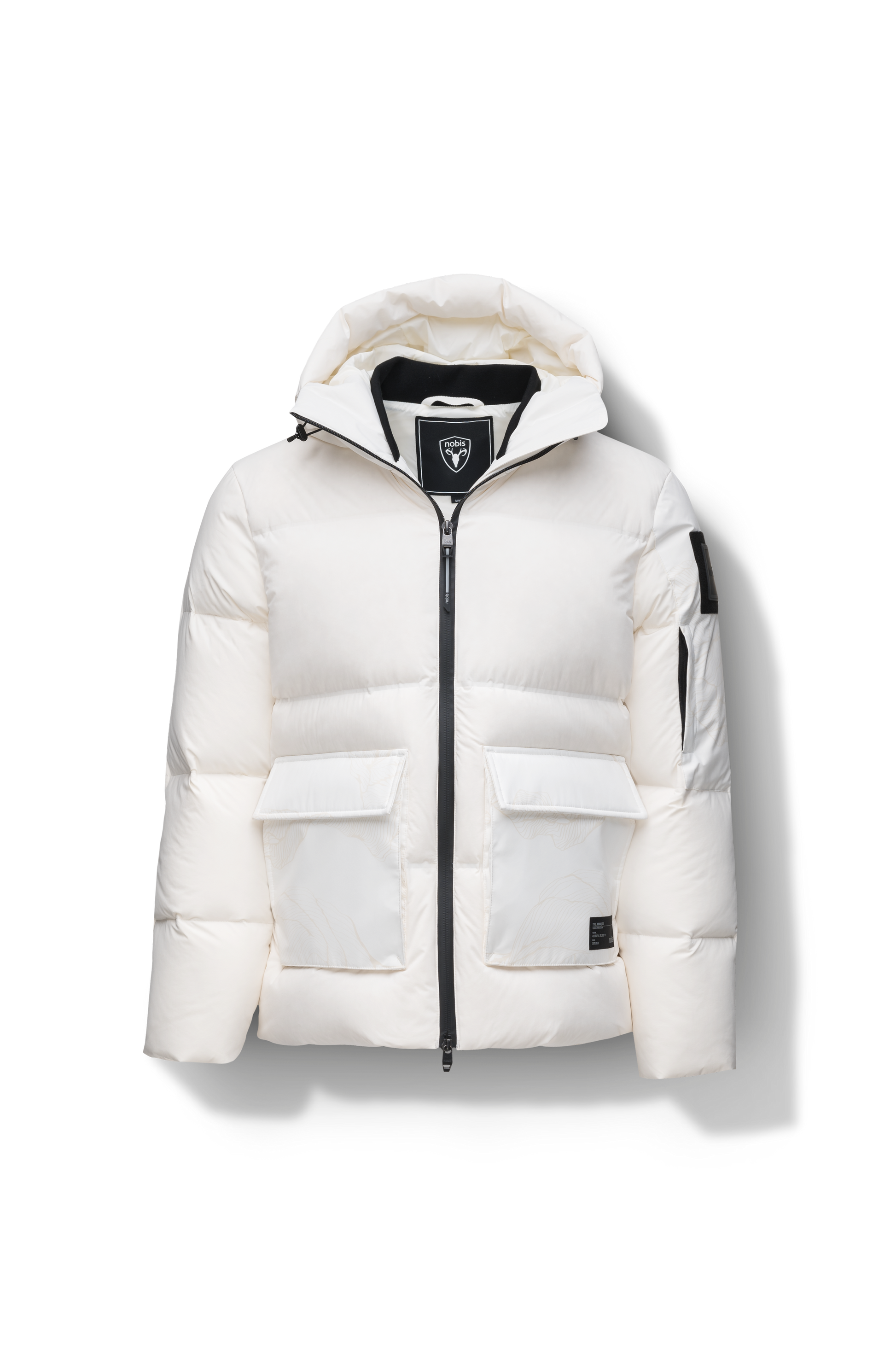 Supra Men's Performance Puffer in hip length, Technical Taffeta and 3-Ply Micro Denier fabrication, Premium Canadian White Duck Down insulation, non-removable down filled hood, centre front two-way zipper, flap pockets at waist, and zipper pocket at left bicep, in Chalk