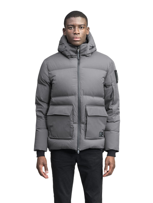 Supra Men's Performance Puffer in hip length, Technical Taffeta and 3-Ply Micro Denier fabrication, Premium Canadian White Duck Down insulation, non-removable down filled hood, centre front two-way zipper, flap pockets at waist, and zipper pocket at left bicep, in Concrete + Concrete / XS
