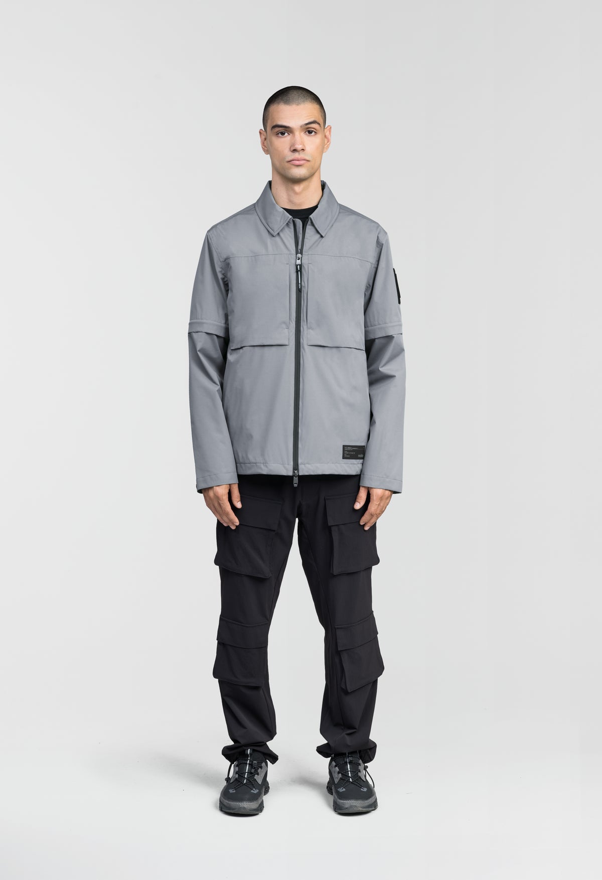Thurlow Men's Performance Zip Off Sleeve Rain Shirt in hip length, convertible collar, patch chest zipper pockets, hidden in-seam pockets, zip off sleeves, centre front two-way zipper closure, in Concrete