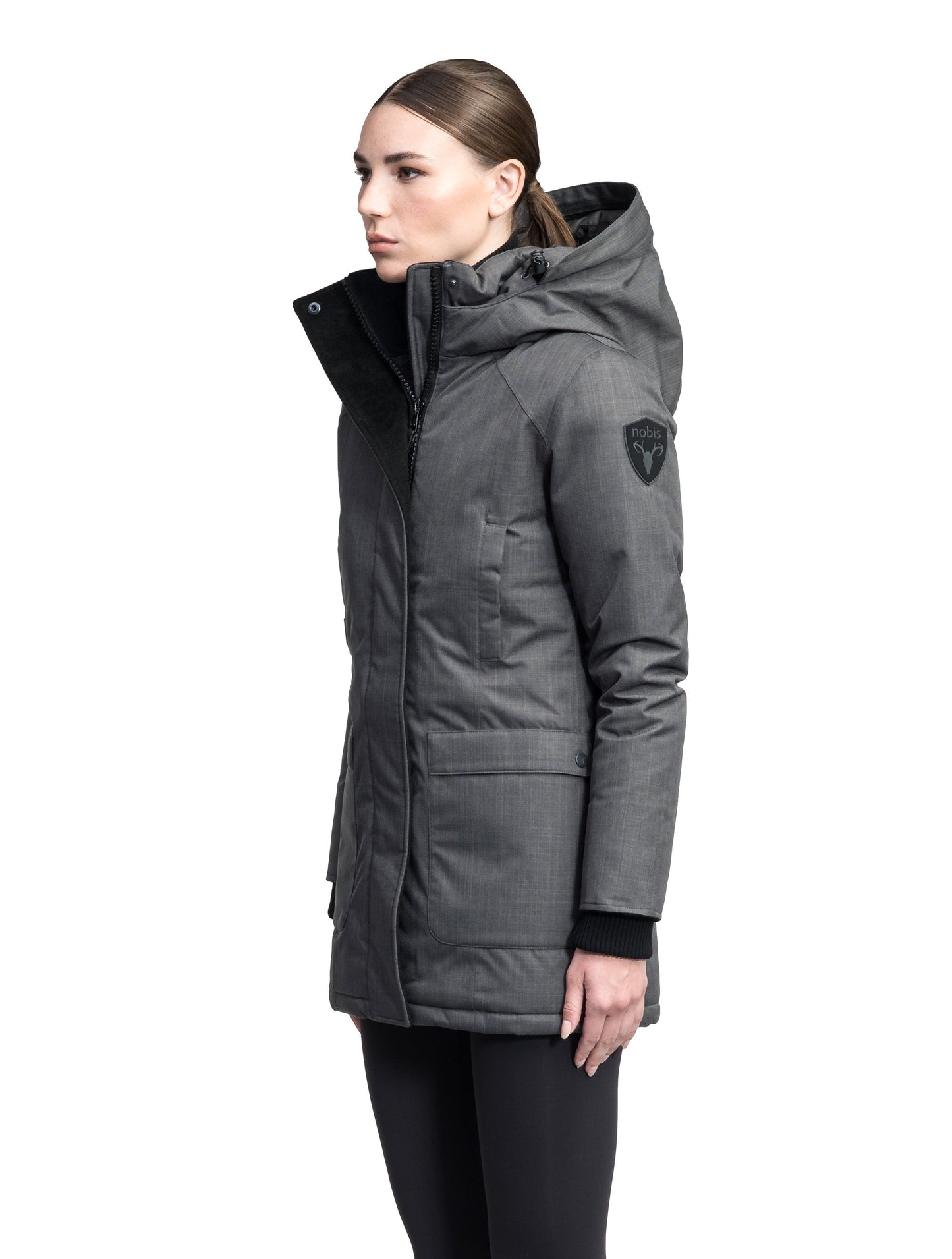 Carla Furless Ladies Parka in thigh length with Canadian Premium White Duck Down insulation, non-removable hood, centre-front zipper with magnetic closure wind flap, and four exterior pockets, in Steel Grey