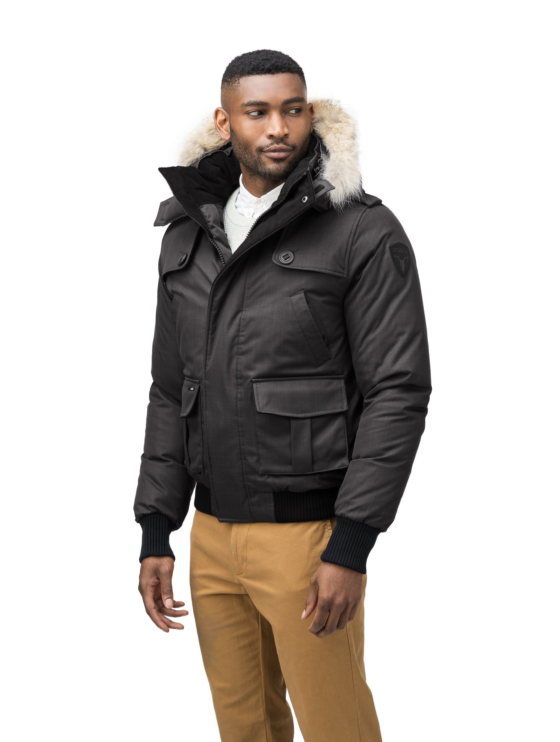 Men's down filled bomber that sits just above the hips with a completely removable hood that's windproof, waterproof, and breathable in CH Black