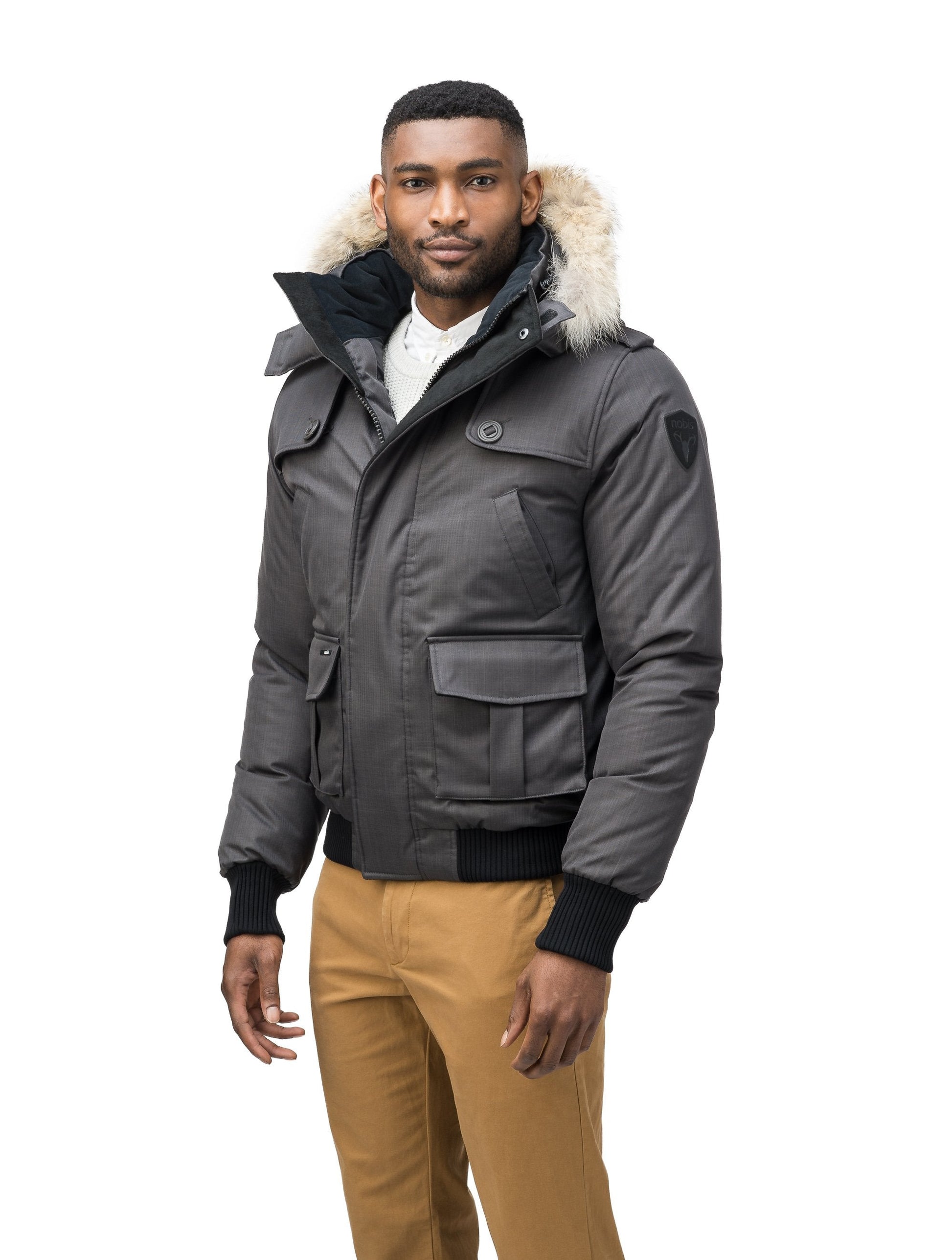 Men's down filled bomber that sits just above the hips with a completely removable hood that's windproof, waterproof, and breathable in CH Steel Grey