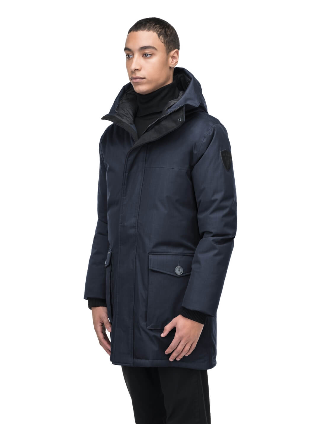 Yves Furless Men's Parka in thigh length, Canadian white duck down insulation, non-removable down-filled hood, flap pockets at waist, centre-front two-way zipper with magnetic wind flap, and elastic ribbed cuffs, in CH Navy